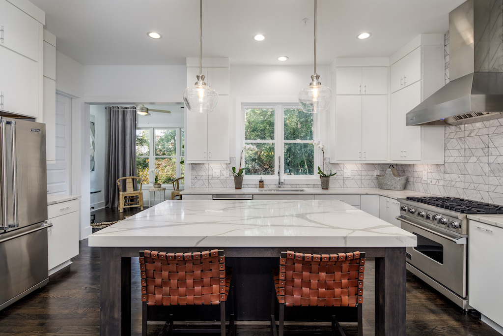 The kitchen of our new model home boasts stunning details throughout