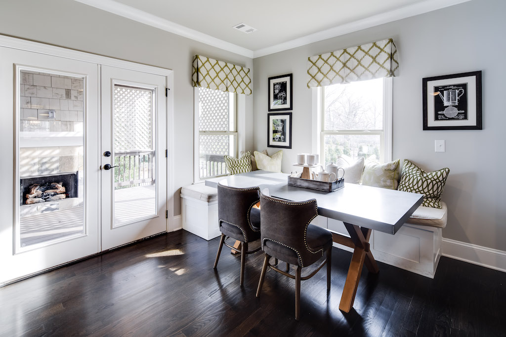 Comfortable window seating is the perfect solution for a secluded dining space in an open floor plan.