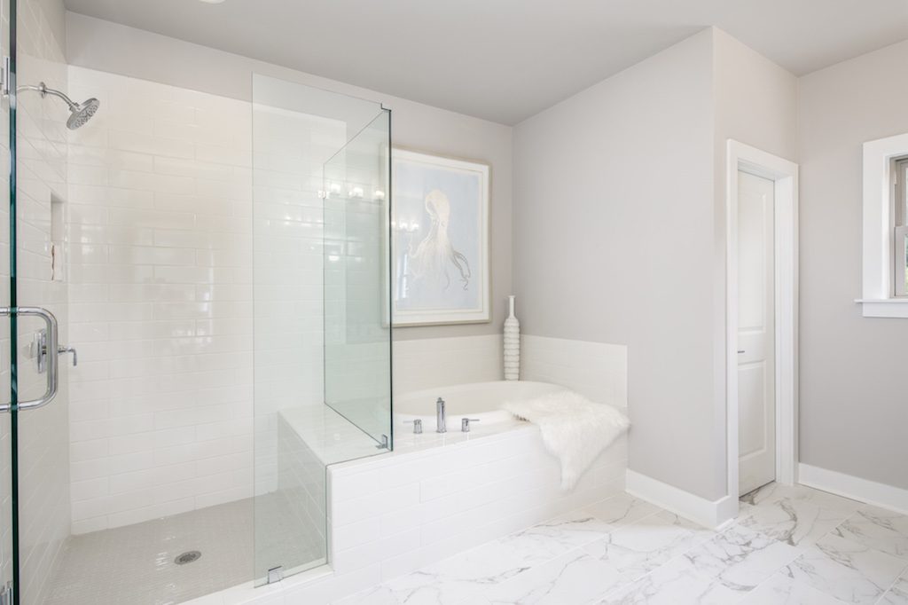 Shades of white, gray, and ivory can help you create a tranquil bathroom environment.