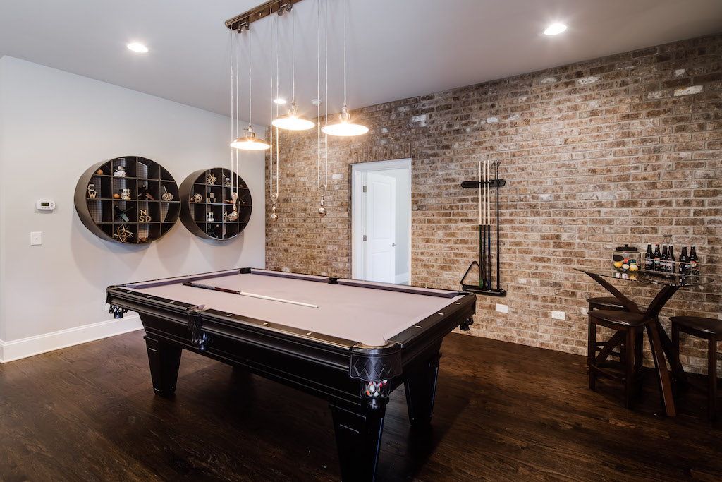 The brick texture in this Park Chase basement adds the perfect hint of industrial charm.