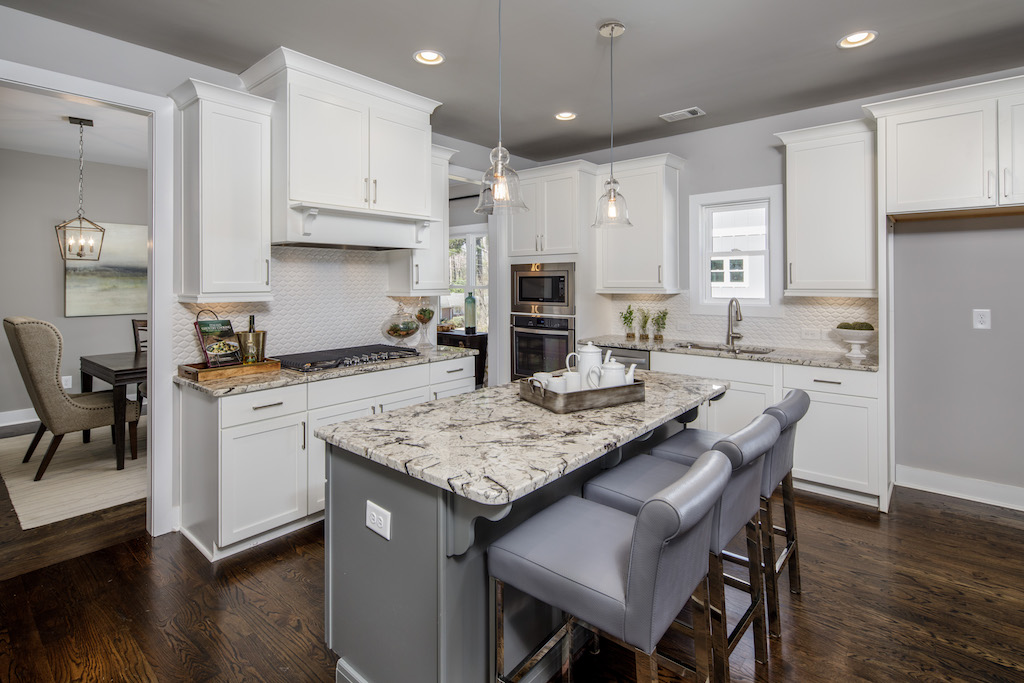 The backsplash in this Park Chase kitchen adds texture through subtle yet elaborate detail.