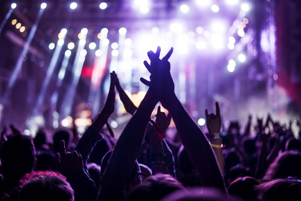 Atlanta concert crowd enjoying live music performance - credit: bernardbodo / 123RF