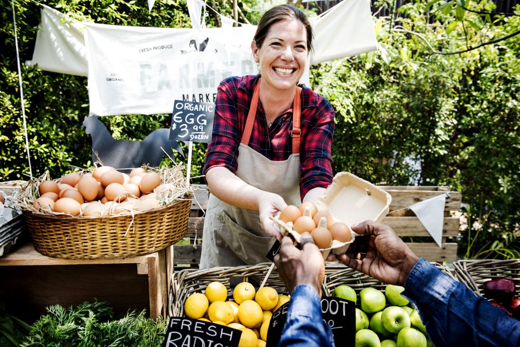 Buying eggs at a community event farmers market, [rawpixel 123rf]