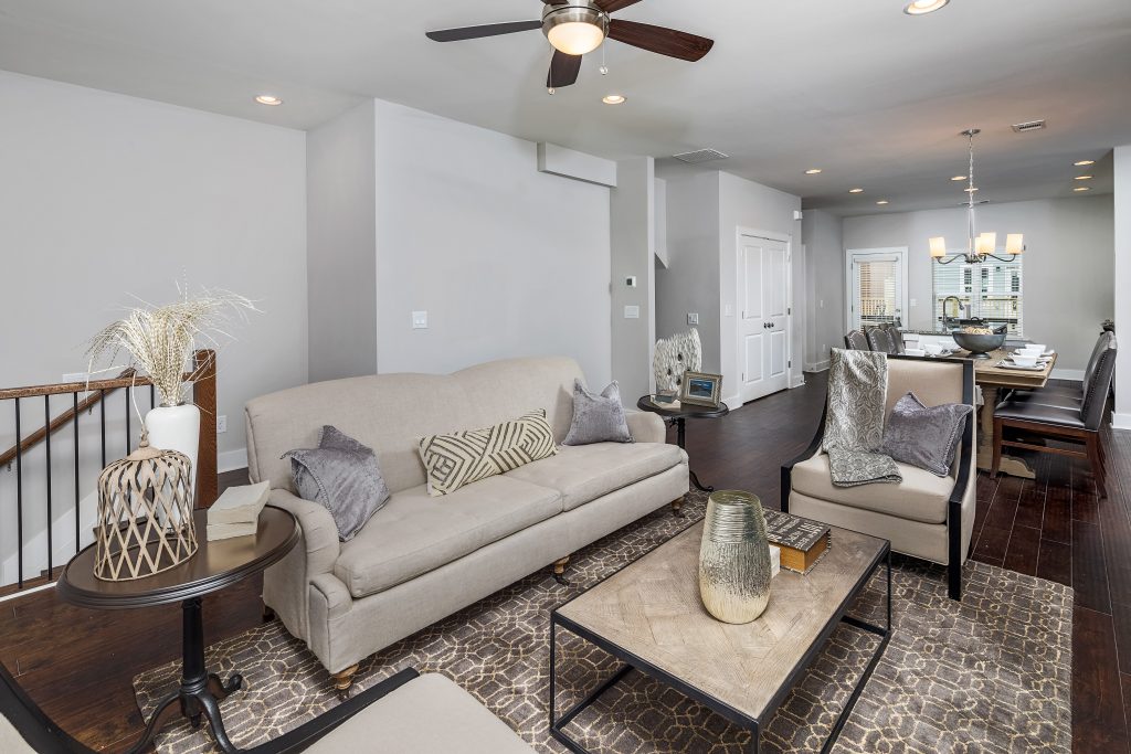 A living room in one of the new townhomes available in Eastland Gates