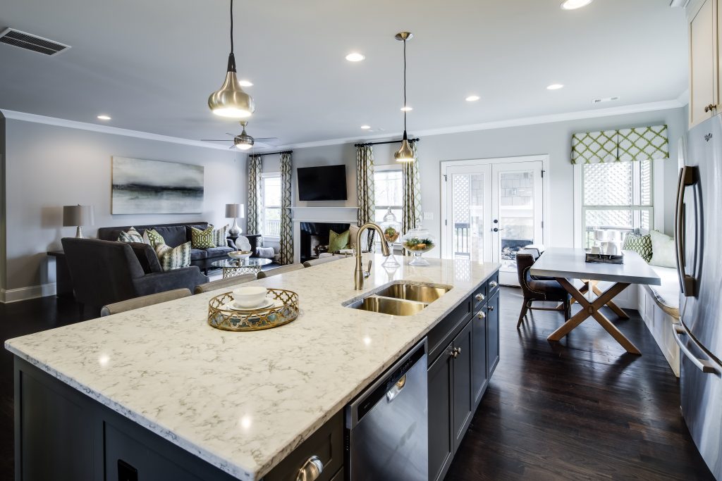 A kitchen island with sink in Park Chase