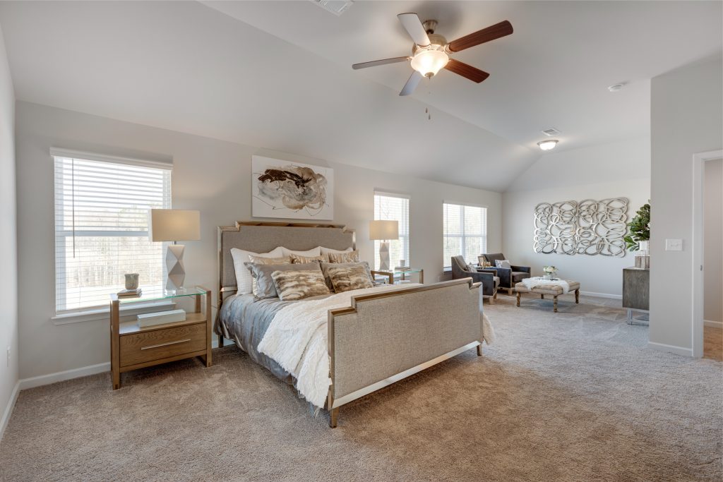 An owner suite bedroom in Trinity Park