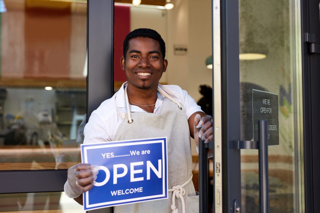 A small business owner in Stonecrest opening his store Roman Chazov © Shutterstock