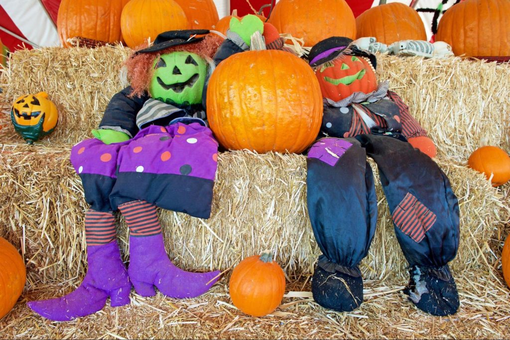 Decorative scarecrows with pumpkins during a fall festival ©Philip Pilosian
