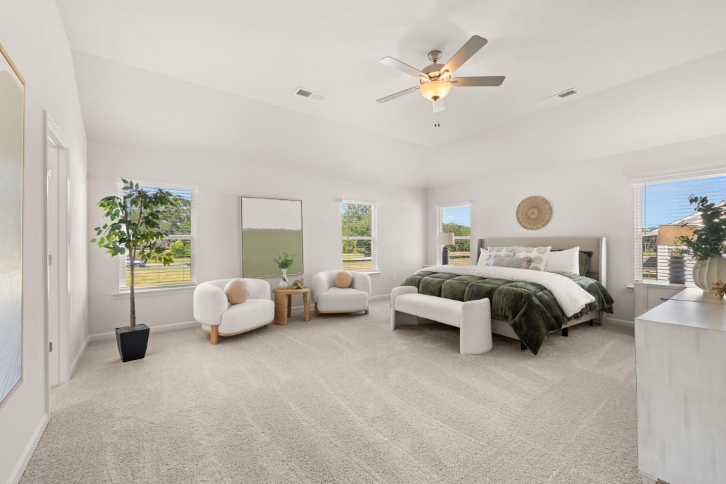 Bright, spacious bedroom in a Rockhaven home with low-maintenance houseplants.
