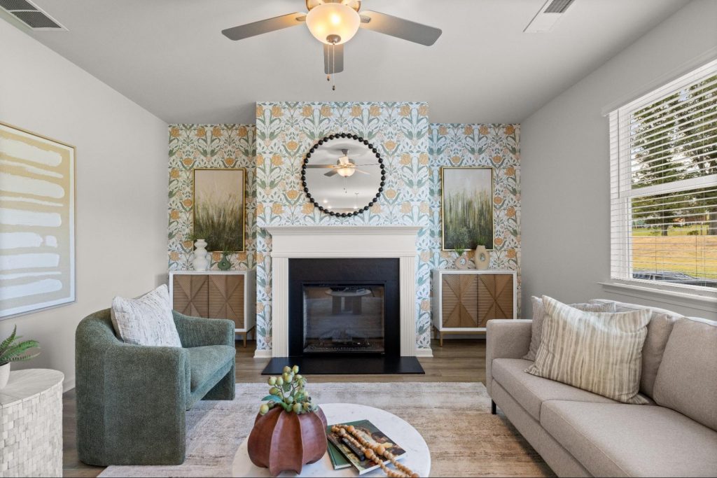 Cozy Rockhaven living room with warm lighting, patterned wallpaper, and inviting seating.