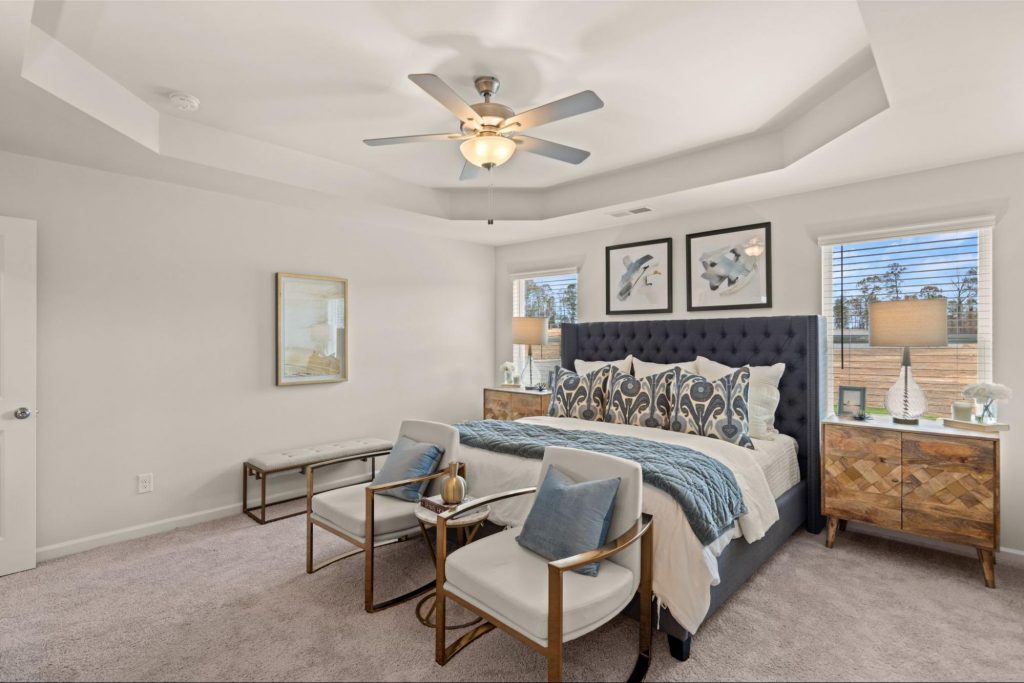 Cozy Rockhaven bedroom with blue and wooden accents, layered textiles, and warm lighting.