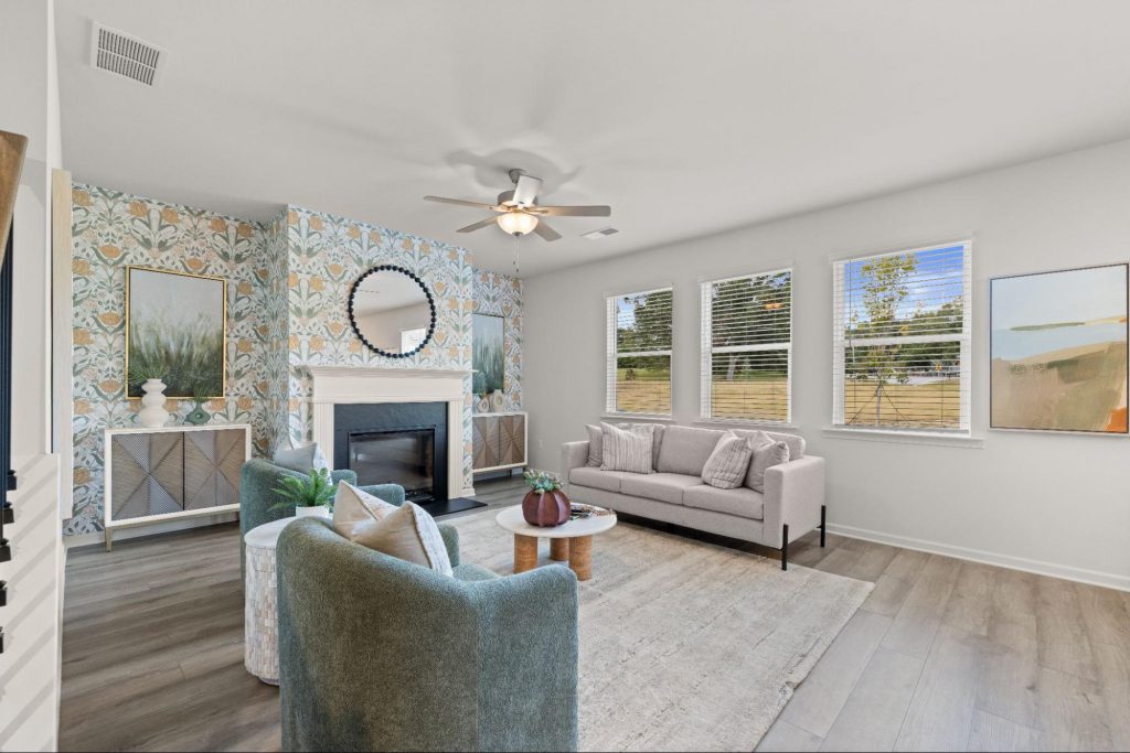 Luxury living room with fireplace and modern decor at Kingsmere Estates.