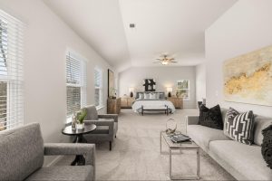 Spacious primary bedroom with vaulted ceilings in Alcovy Village.