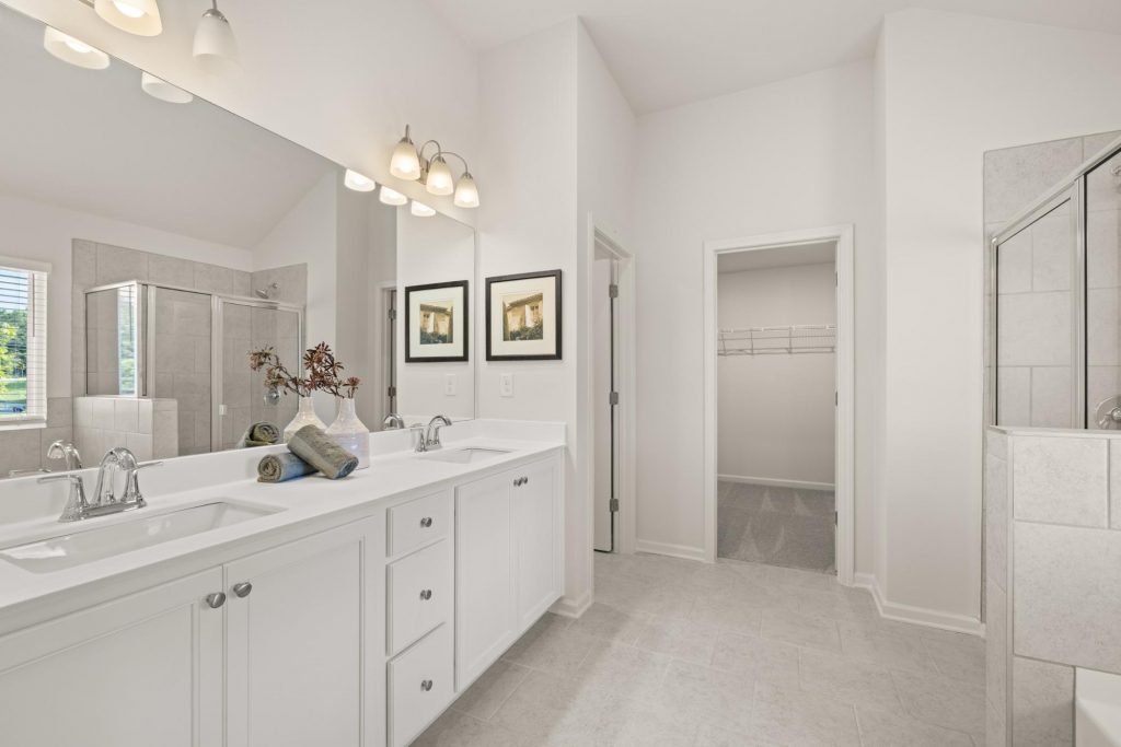 Bright primary bathroom double vanity at Kingsmere Estates.