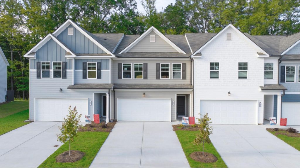 Modern townhomes at Cambridge at Towne Center with HOA covered exterior maintenance typical in townhome HOA communities