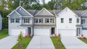 Modern townhomes at Cambridge at Towne Center with HOA covered exterior maintenance typical in townhome HOA communities