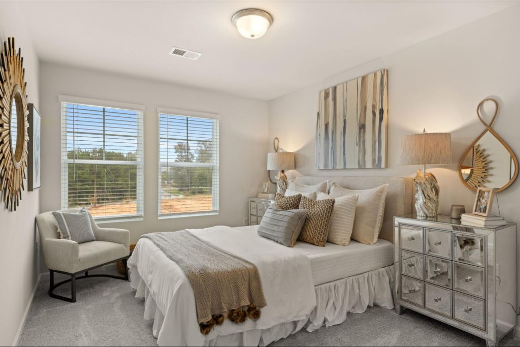 Decorated bedroom with framed wall art and personalized home décor
