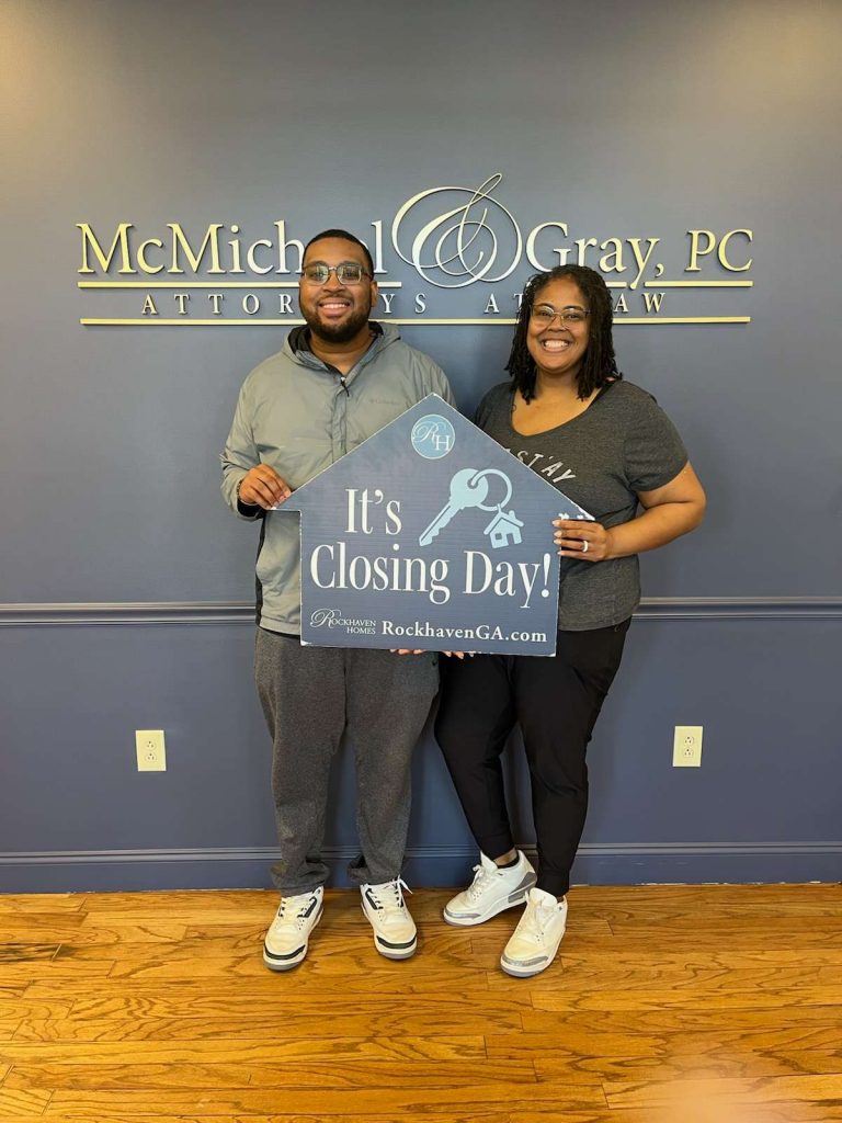 Happy Rockhaven homeowners celebrating closing day